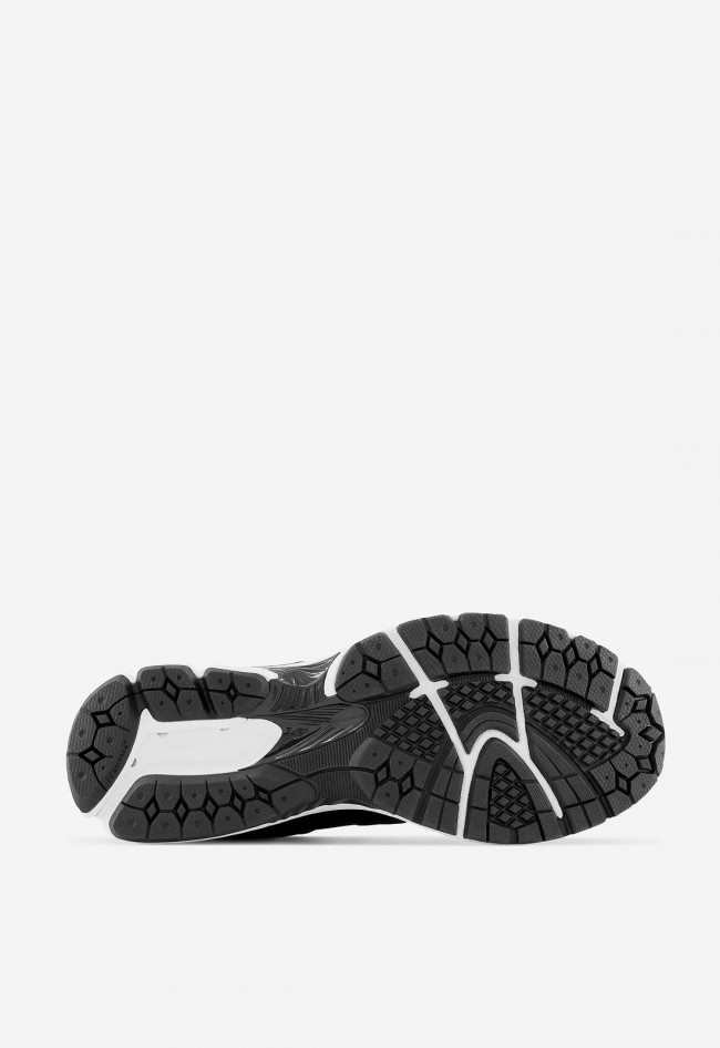 Zapatilla de mujer New Balance negra con tecnología ABZORB y diseño retro 2000s | Confort deportivo y estilo urbano