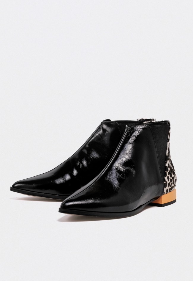Botín de mujer en piel negra con detalle animal print Glo Catwoman – Elegancia audaz