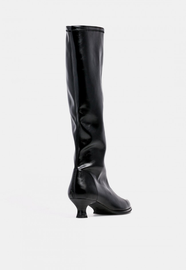 Bota alta de mujer MISS ELASTIC 75336 de material sintético negro, con tacón bajo